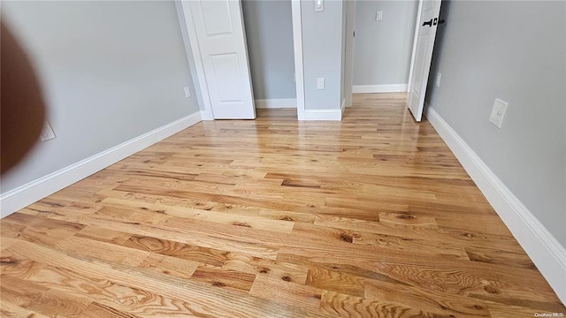 unfurnished bedroom featuring light wood-type flooring