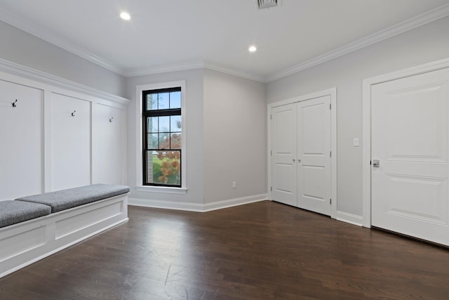 mudroom featuring dark wood-type flooring and ornamental molding