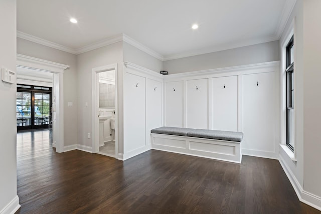 mudroom with crown molding and dark hardwood / wood-style flooring