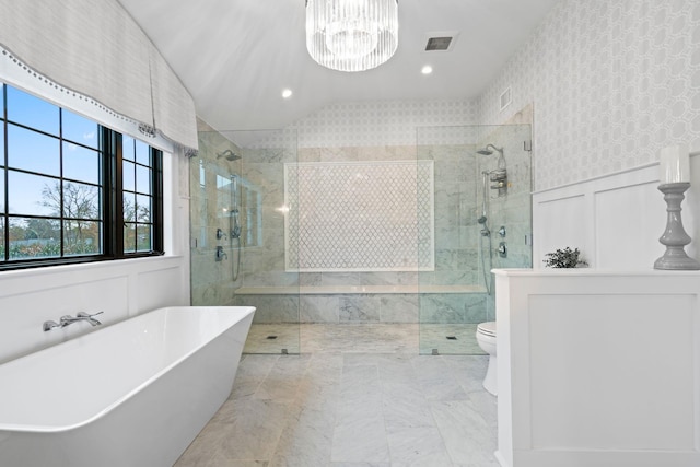 bathroom featuring plus walk in shower, lofted ceiling, a notable chandelier, and toilet