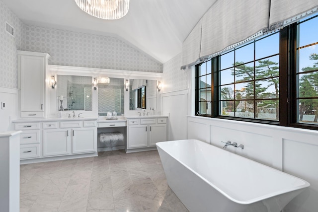 bathroom featuring lofted ceiling, plus walk in shower, vanity, and a notable chandelier