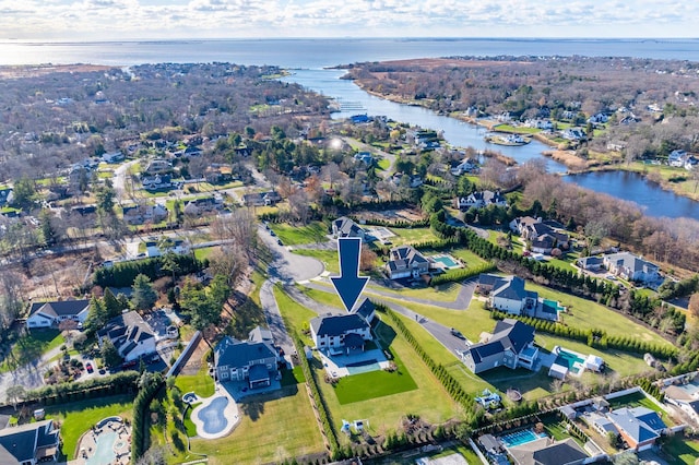 birds eye view of property with a water view