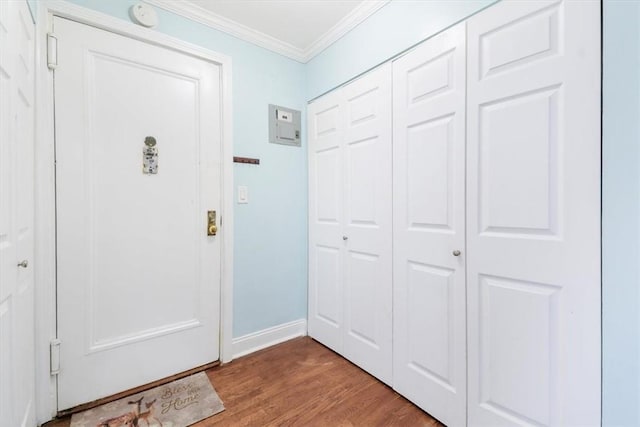 entryway featuring light hardwood / wood-style floors and ornamental molding