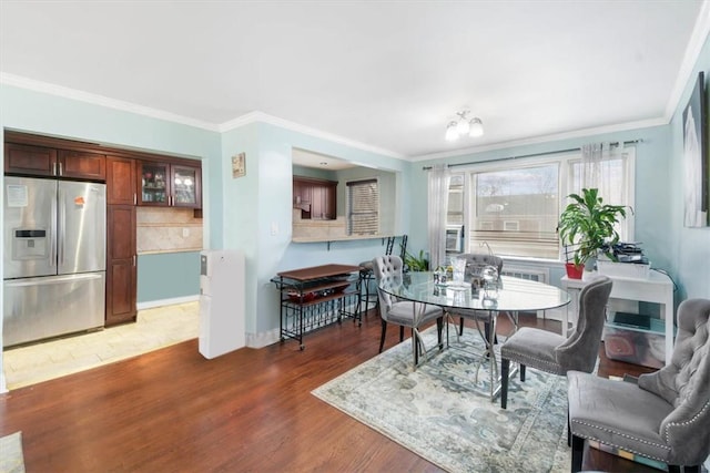 2 Soundview Ave Unit 2D, White Plains, NY 10606 - dining space featuring wood finished floors and crown molding