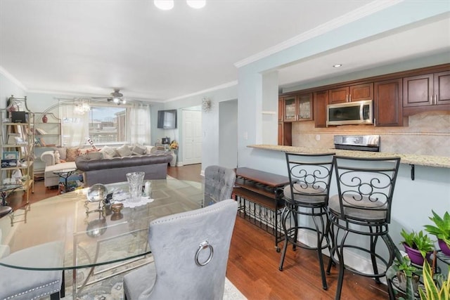 2 Soundview Ave Unit 2D, White Plains, NY 10606 - dining area with ornamental molding, wood finished floors, and ceiling fan