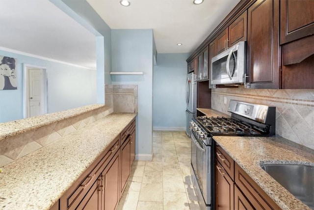 2 Soundview Ave Unit 2D, White Plains, NY 10606 - kitchen with stainless steel appliances, tasteful backsplash, light stone counters, recessed lighting, and open shelves
