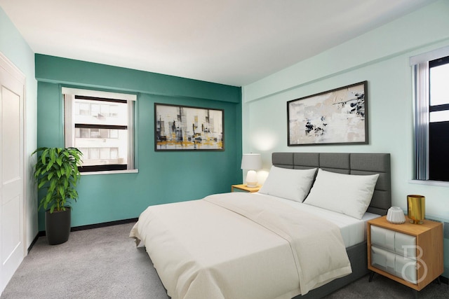 bedroom featuring light colored carpet