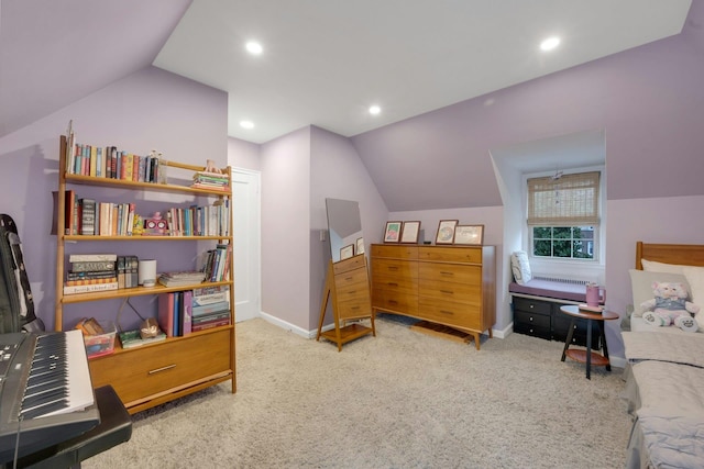 carpeted bedroom with lofted ceiling