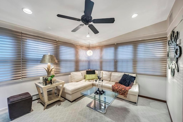 living room with ceiling fan, light colored carpet, and vaulted ceiling