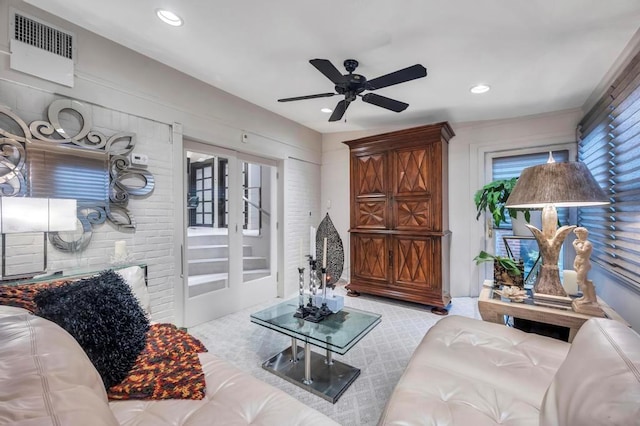 living room featuring ceiling fan and carpet floors