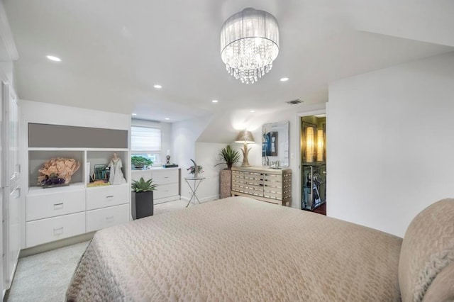 bedroom with a notable chandelier and light carpet