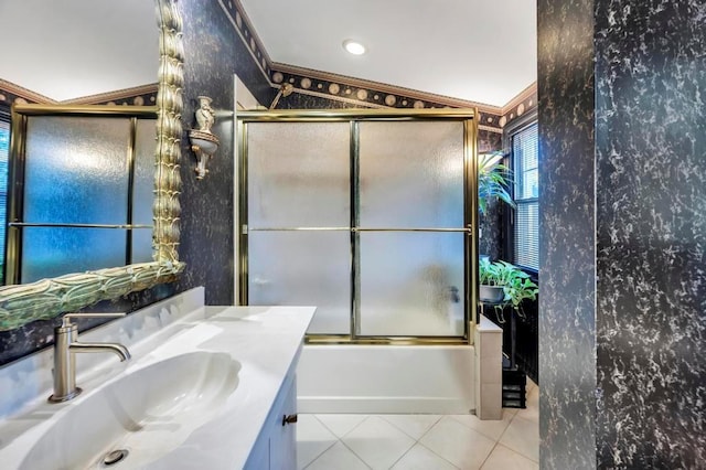 bathroom featuring tile patterned floors, bath / shower combo with glass door, vaulted ceiling, vanity, and ornamental molding