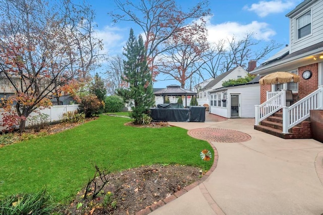 view of yard featuring a gazebo and a patio