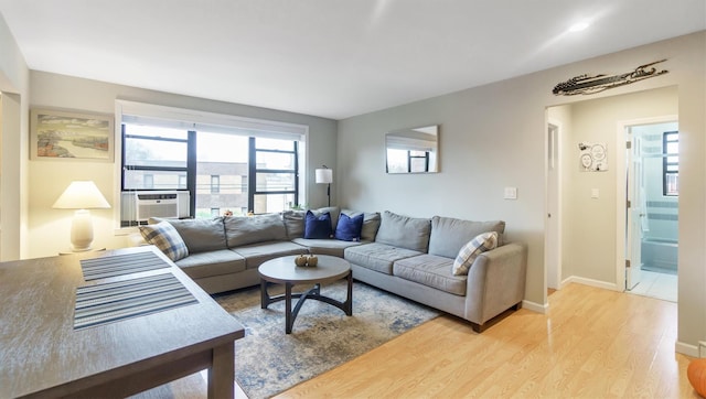 living room featuring light hardwood / wood-style flooring and cooling unit