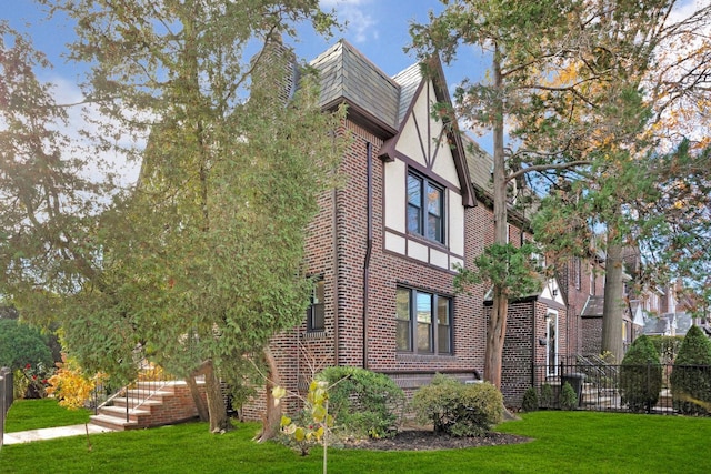 view of home's exterior featuring a lawn