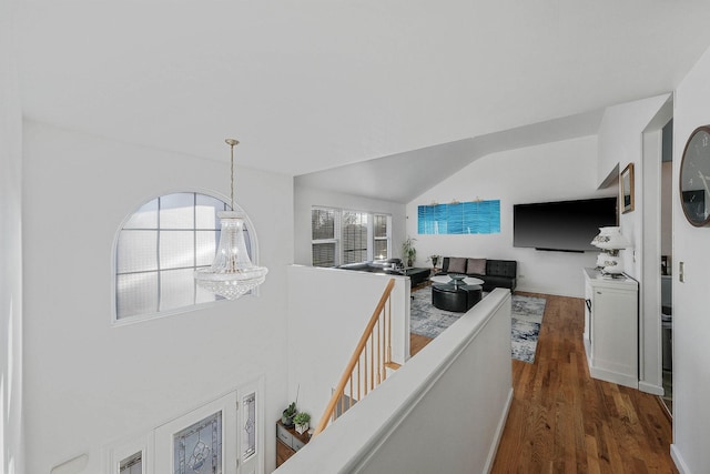 interior space with dark hardwood / wood-style flooring and an inviting chandelier