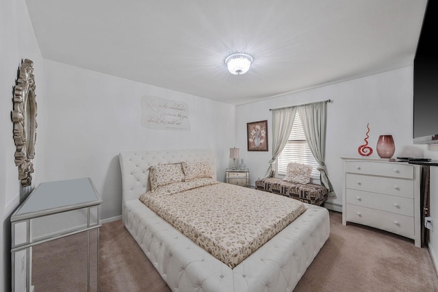 bedroom with light colored carpet and baseboard heating