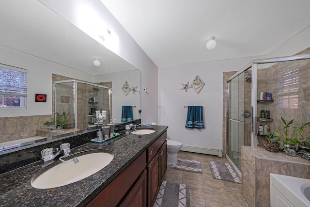 full bathroom featuring tile patterned flooring, separate shower and tub, toilet, and baseboard heating