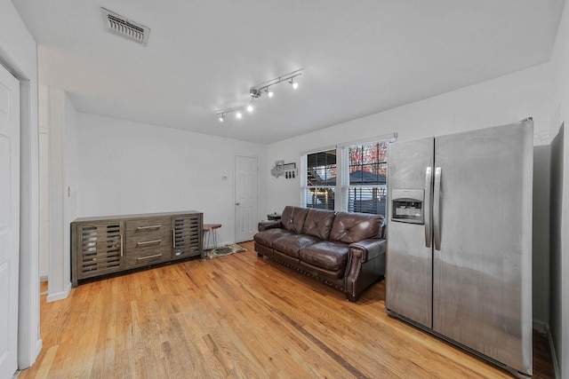 living room with light hardwood / wood-style floors