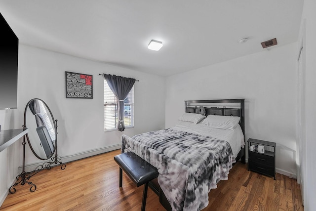 bedroom featuring wood-type flooring