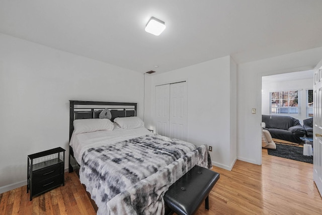 bedroom with a closet and wood-type flooring