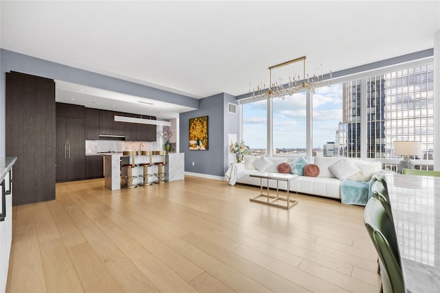 living room with light hardwood / wood-style flooring