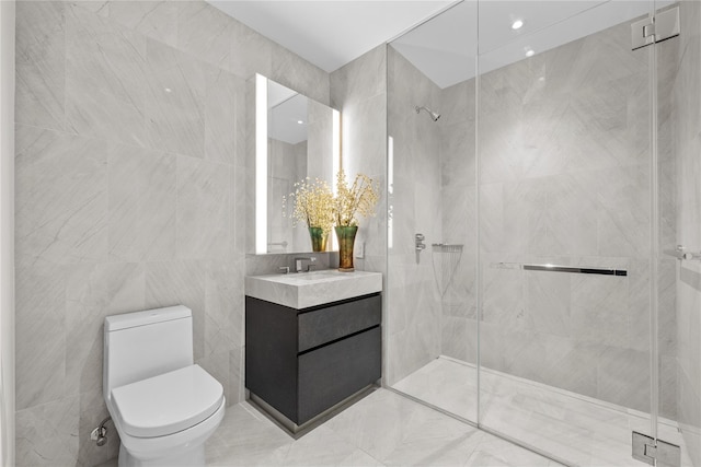 bathroom featuring an enclosed shower, vanity, toilet, and tile walls