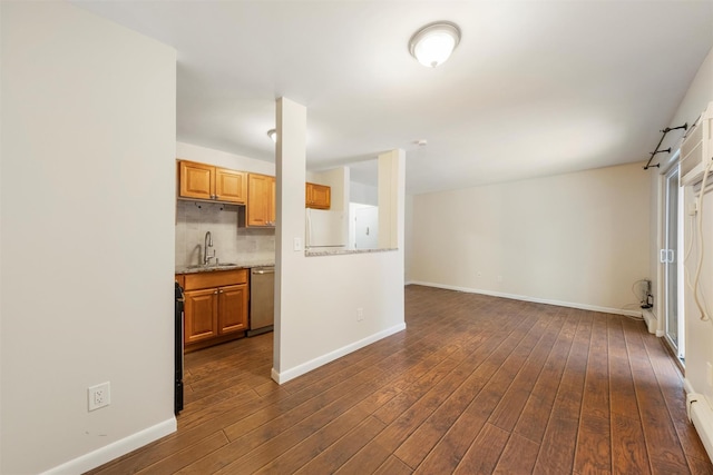 kitchen with sink, dishwasher, tasteful backsplash, dark hardwood / wood-style floors, and white refrigerator