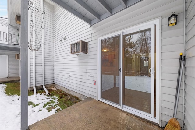 entrance to property featuring a patio