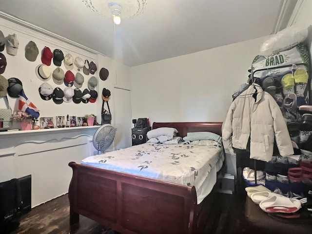 bedroom featuring dark hardwood / wood-style flooring