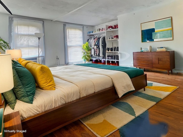 bedroom featuring a closet and hardwood / wood-style floors