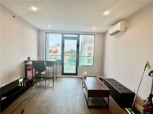 interior space featuring a wall mounted AC and hardwood / wood-style floors