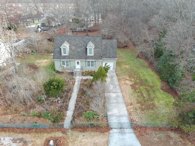 view of front of property featuring a garage and a front lawn