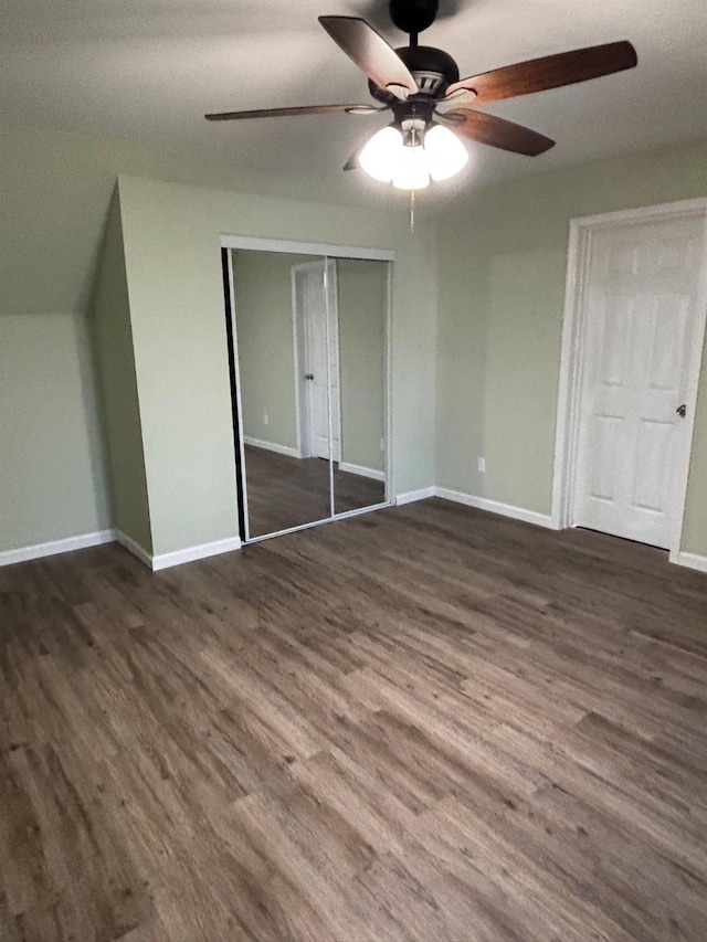 unfurnished bedroom with a closet, ceiling fan, and dark hardwood / wood-style floors