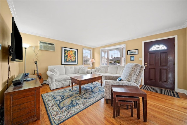 living room featuring hardwood / wood-style floors, a baseboard radiator, a wall mounted air conditioner, and ornamental molding