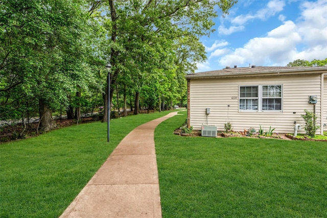 423 Woodbridge Unit D, Ridge, NY 11961 - view of grassy yard with central AC unit