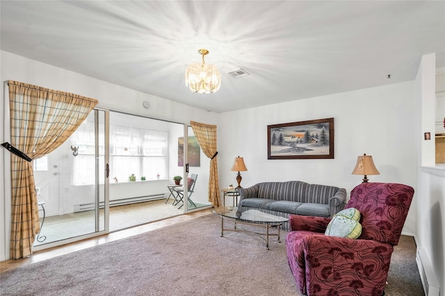 423 Woodbridge Unit D, Ridge, NY 11961 - living room with baseboard heating, a chandelier, and carpet flooring
