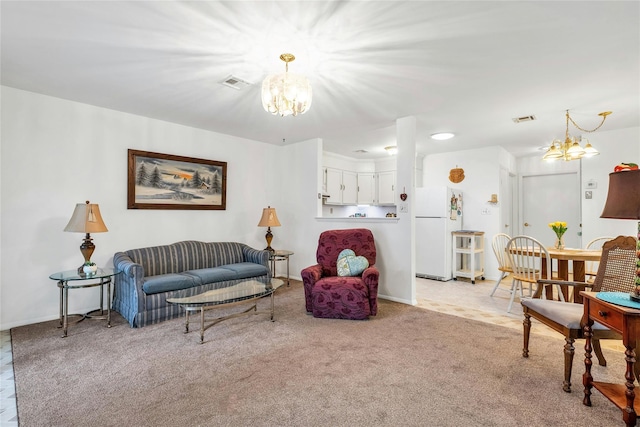 423 Woodbridge Unit D, Ridge, NY 11961 - living area with a chandelier, light carpet, and baseboards