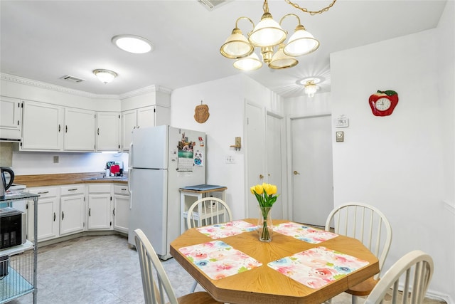 423 Woodbridge Unit D, Ridge, NY 11961 - dining space with a chandelier