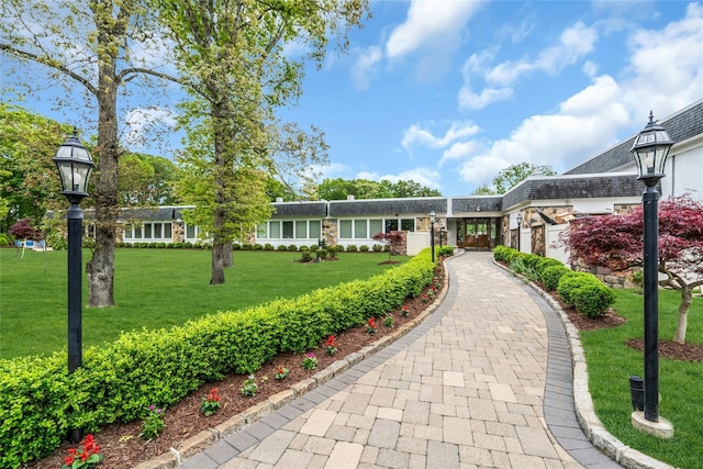 423 Woodbridge Unit D, Ridge, NY 11961 - view of front of home with a front yard, driveway, and an attached garage