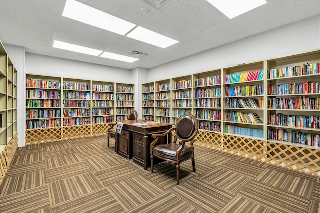 423 Woodbridge Unit D, Ridge, NY 11961 - carpeted office space featuring bookshelves and a drop ceiling