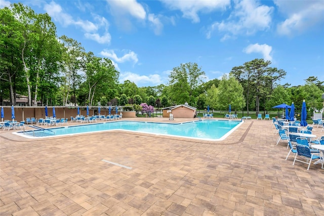 423 Woodbridge Unit D, Ridge, NY 11961 - community pool with a patio area and view of scattered trees