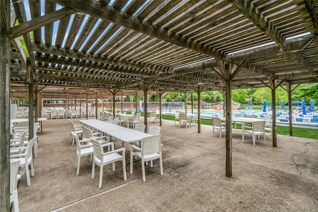 423 Woodbridge Unit D, Ridge, NY 11961 - view of patio featuring a pergola and a community pool