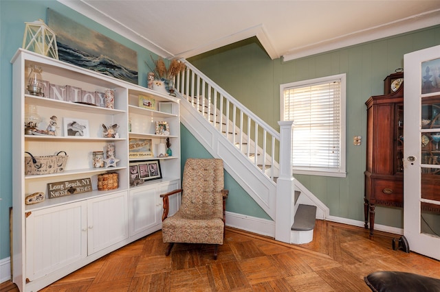 sitting room featuring parquet flooring