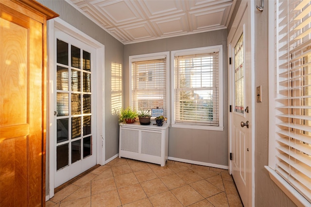 entryway with light tile patterned floors