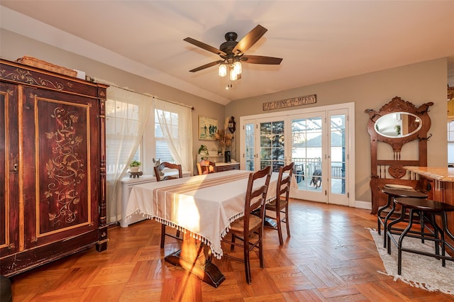 dining area featuring ceiling fan, light parquet floors, and french doors