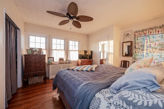 bedroom with ceiling fan and dark hardwood / wood-style flooring