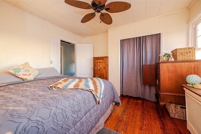 bedroom with ceiling fan and dark wood-type flooring