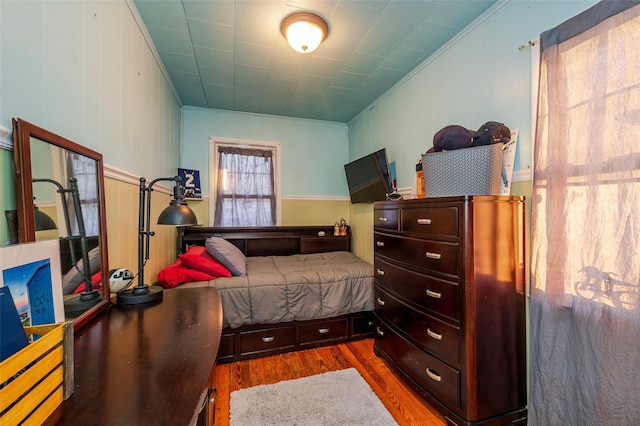 bedroom with dark hardwood / wood-style flooring