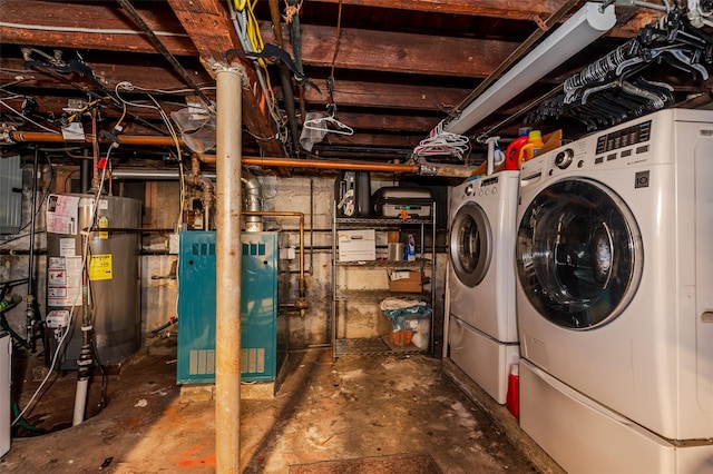 basement with separate washer and dryer and water heater